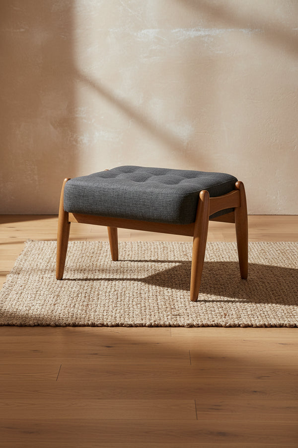 Repose-pieds ottoman en tissu gris foncé et bois finition noyer
